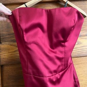 Classic Nicole Miller strapless formal satin gown in crimson with tuxedo back.